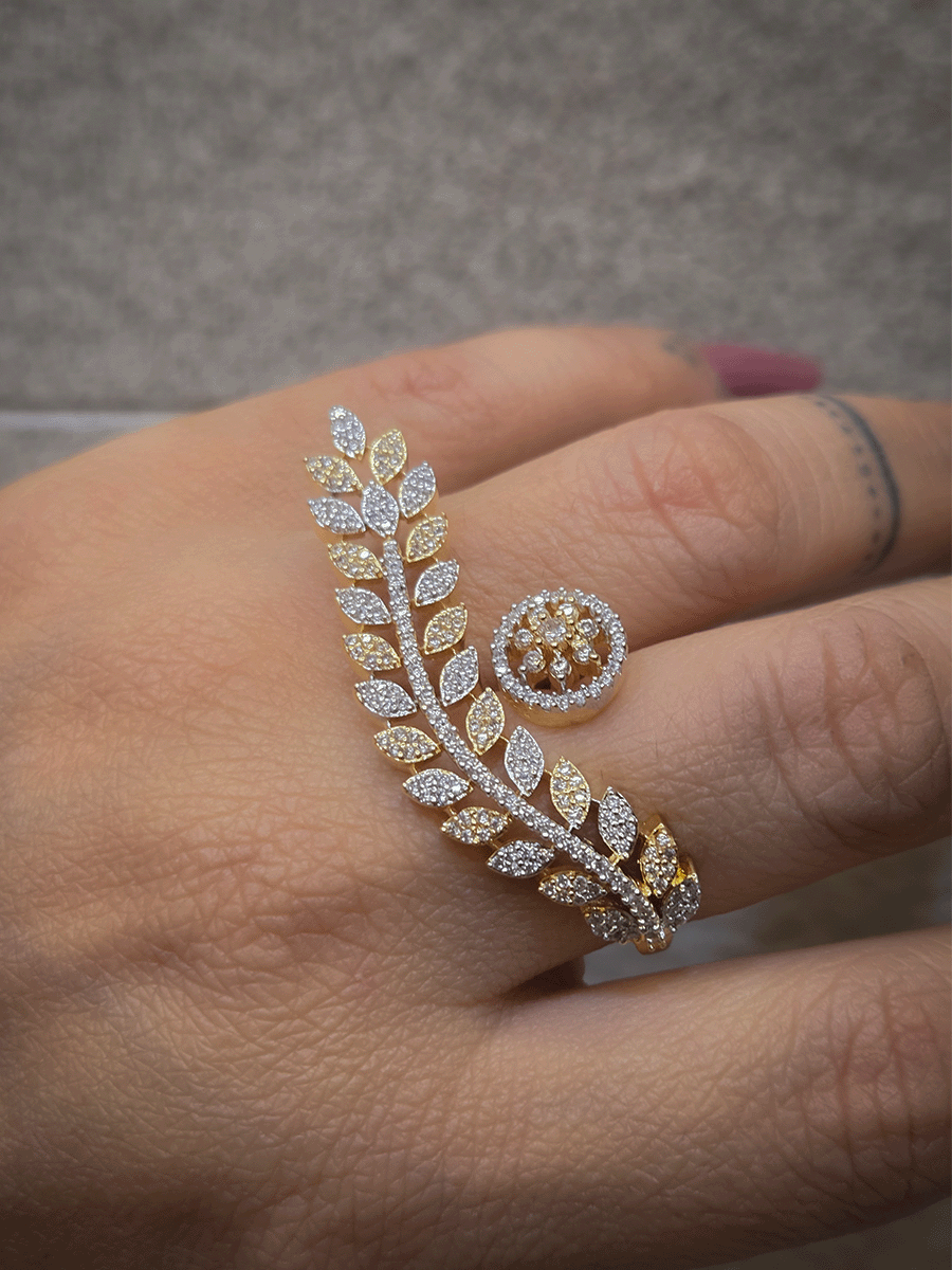 Gold and silver finish zircon studded long leaf on one end and circular on other end of openable ring