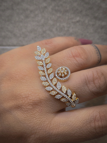 Gold and silver finish zircon studded long leaf on one end and circular on other end of openable ring