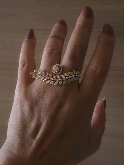 Gold and silver finish zircon studded long leaf on one end and circular on other end of openable ring