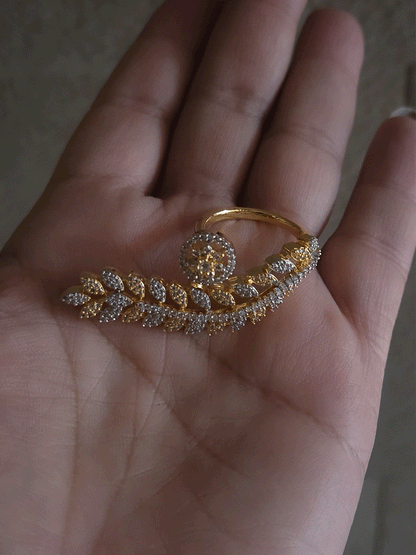 Gold and silver finish zircon studded long leaf on one end and circular on other end of openable ring