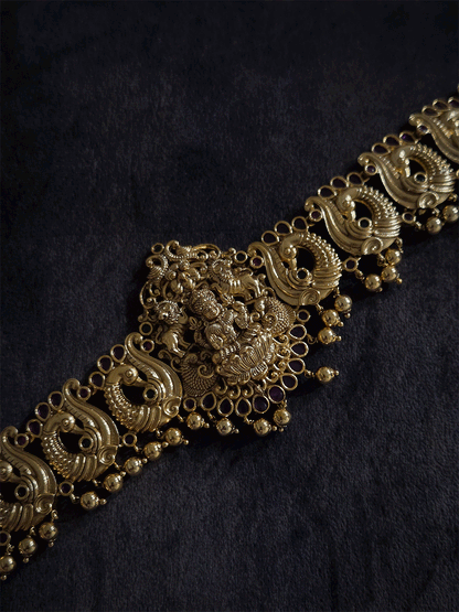Laxmiji motif in center on peacock side design waist belt with gold bead hangings