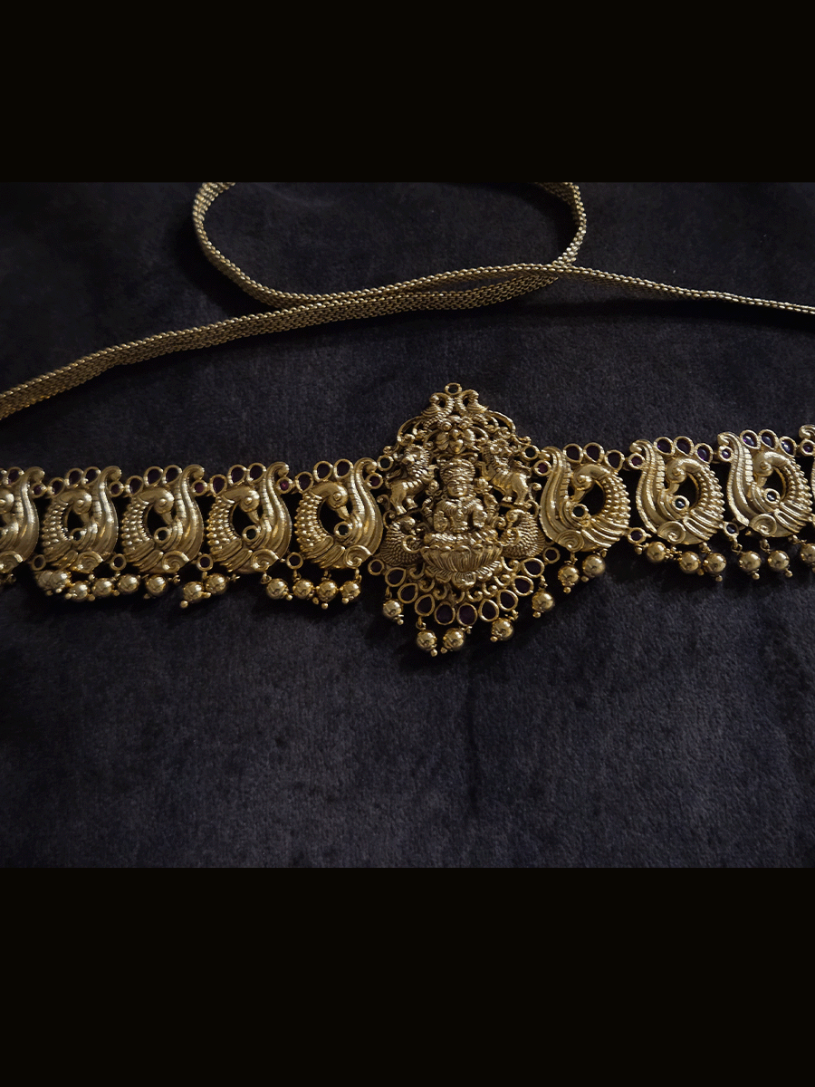 Laxmiji motif in center on peacock side design waist belt with gold bead hangings