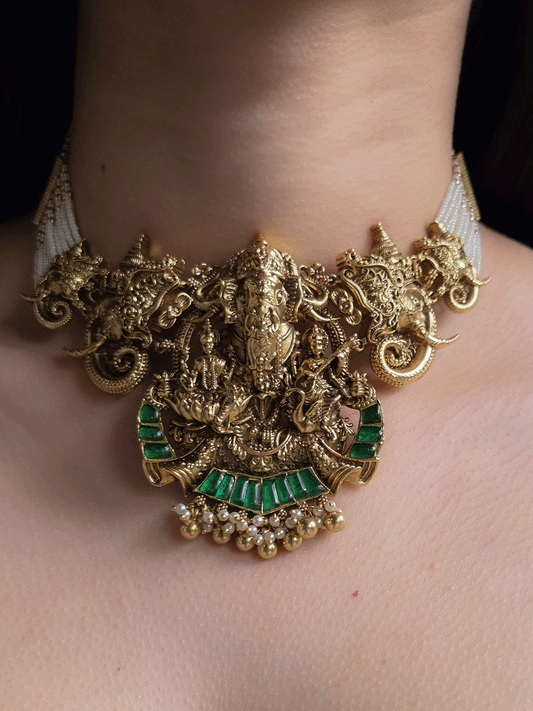 Ganpatiji with Laxmiji and Saraswatiji on both sides bold center design set with intricately carved ganpatiji faces on sides