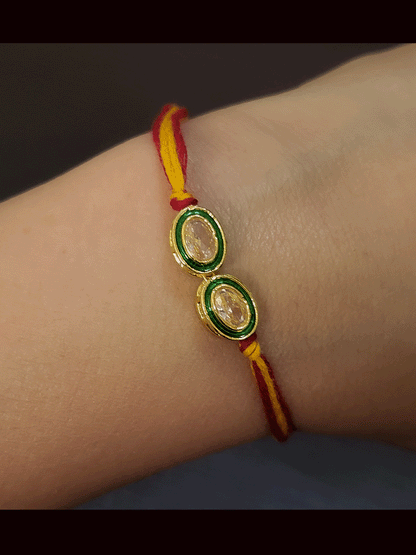 Two different shaped green enamel brown stones rakhi's(Set of two rakhi's)