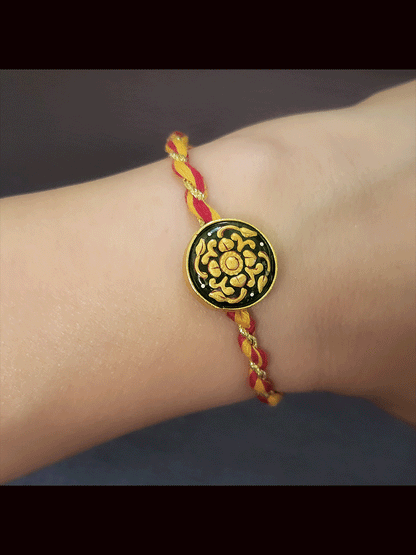 Round maroon and green stone(1.75cm) gold work mauli thread rakhi