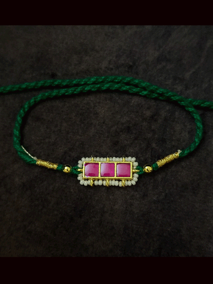 Three paachi kundan pirohi work coloured stones and coloured thread rakhi