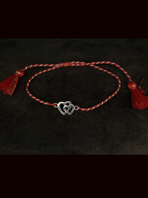 Sterling silver heart on heart pull on red thread rakhi