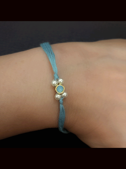 Round stone with side white bead design small rakhi