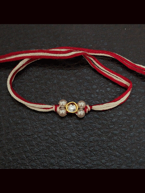 Round stone with side white bead design small rakhi