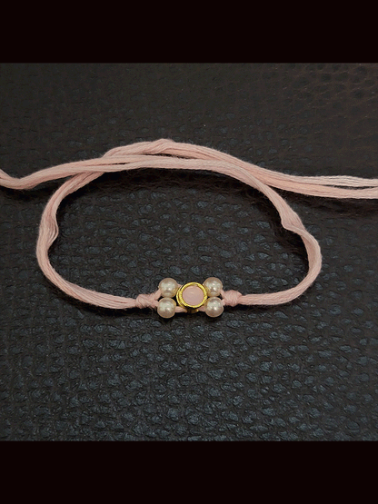 Round stone with side white bead design small rakhi