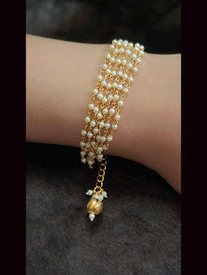 Multiple pearl strings sister or bhabhi bracelet rakhi with gold bead hangings
