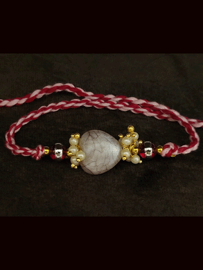 Textured white stone with side pearly cluster beads bhai rakhi