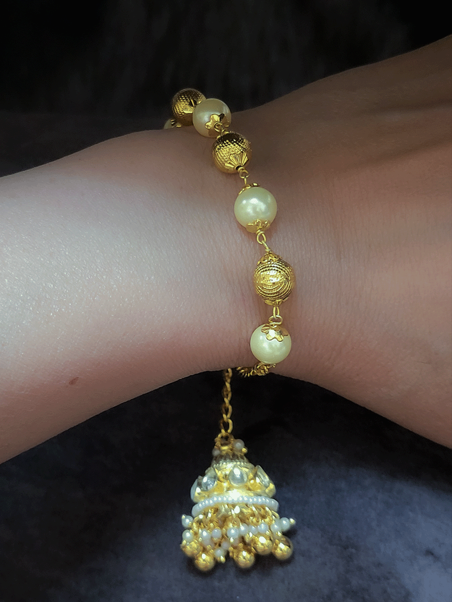Alternate pearl and gold bead sister and bhabhi rakhi with hanging  kundan jhoomki