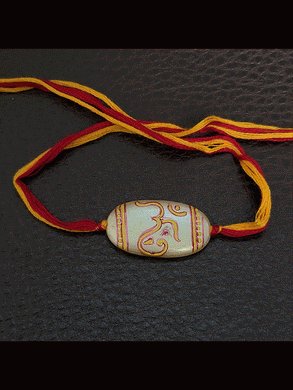 White oval bead with hand painted om and ganpati design