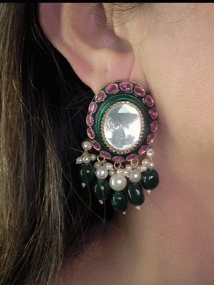 Bold oval uncut polki in center of green enamel choker set with green hanging beads