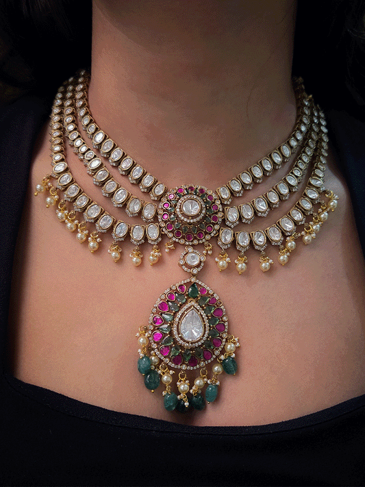 Triple layer moissanite strings set with ruby green circular tukdi in center and aqua drops leaf shaped hanging pendant