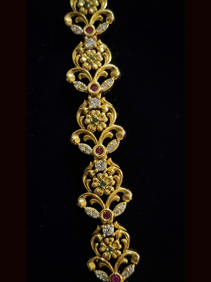 Long round pendant with flower design AD,green and ruby stones studded set