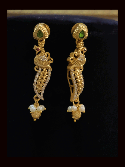 Oval zircon,ruby and green stone peacock design set with peacock design string