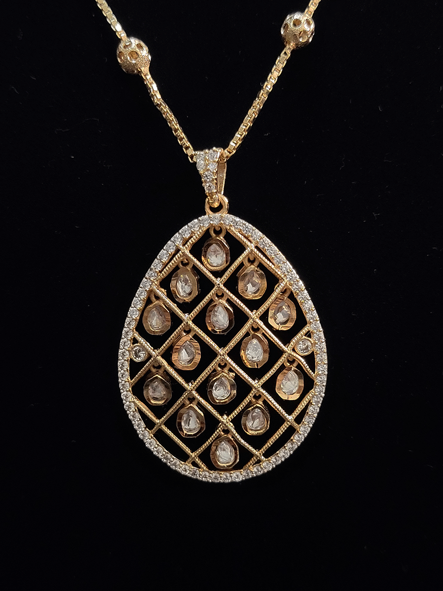 Rosegold finish tear drop shaped pendant set with tear drop kundans hanging in between