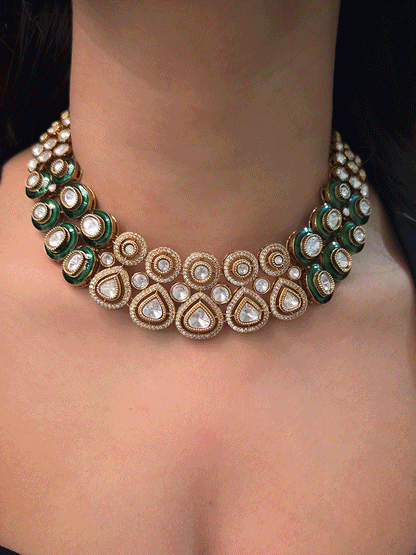 Uncut polki and moissanite studded classy set with green enamel detailing on both sides