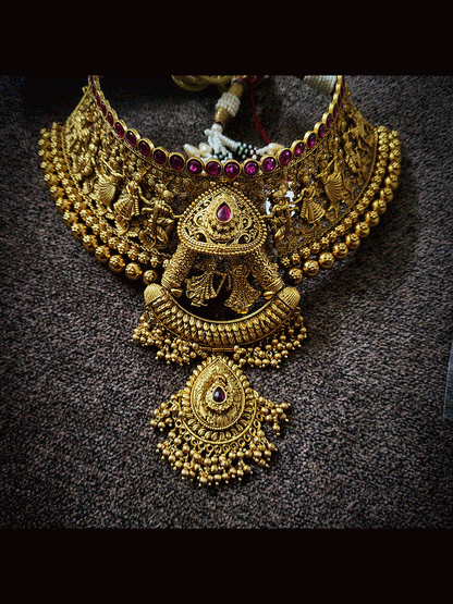 Varmala design broad choker set with long leaf design pendant in the middle with green bead and pearl bead detailing