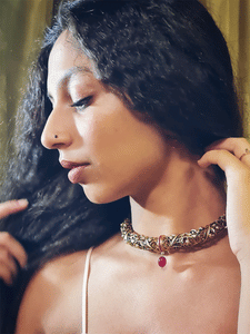 Antique gold finish intricate design hasli with ruby drop - Odara Jewellery