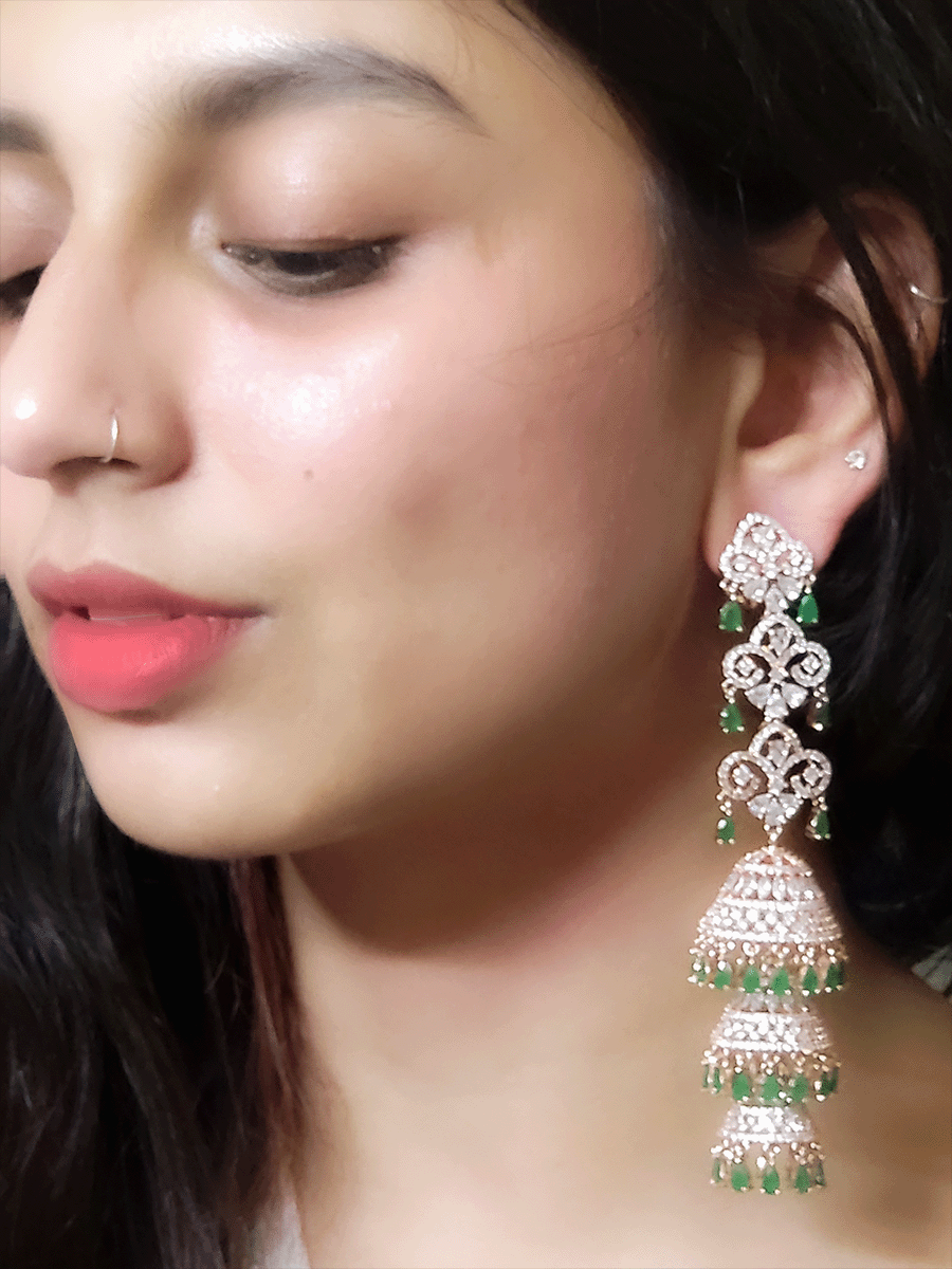 Rosegold finish 12 cm long AD triple layer jhoomki earrings with coloured tear drop stones