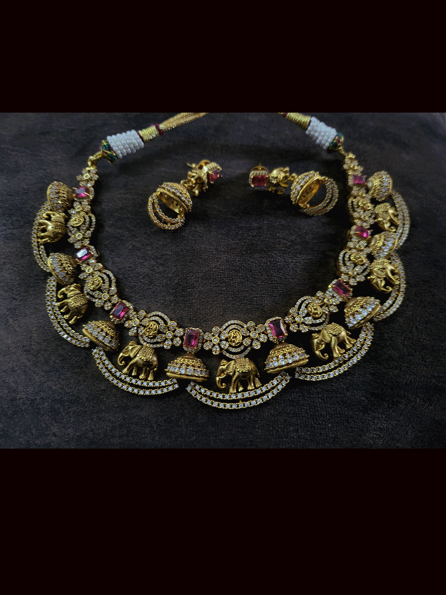 Zircons studded in half jhoomki and elephant design set with rectangular stones