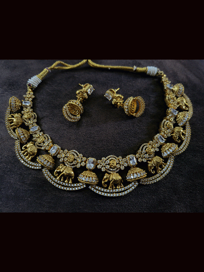 Zircons studded in half jhoomki and elephant design set with rectangular stones