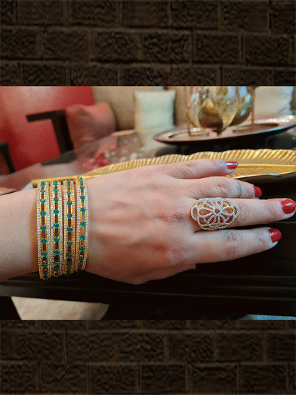 Green stones in between AD line gold finish bangles(set of four) - Odara Jewellery
