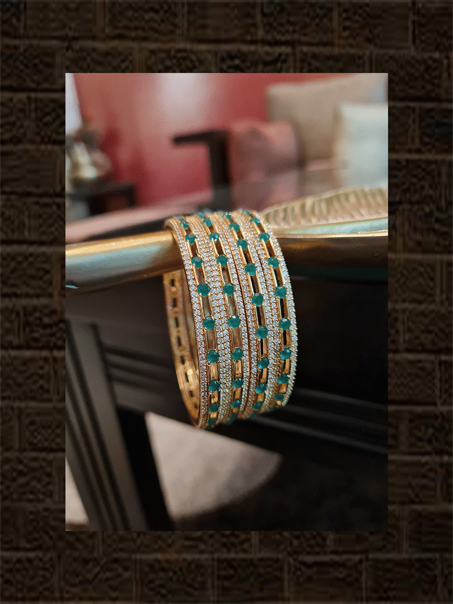 Green stones in between AD line gold finish bangles(set of four) - Odara Jewellery