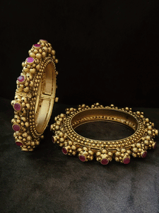Set of two openable pacheli's with gold bead design and ruby stone top
