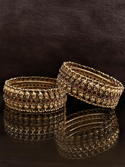 Small elephant faces connecting design openable kada's on both sides of ruby and stone line in the middle - Odara Jewellery
