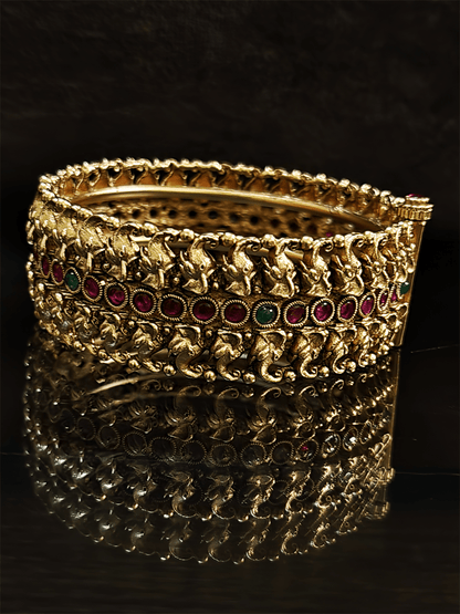 Small elephant faces connecting design openable kada's on both sides of ruby and stone line in the middle - Odara Jewellery