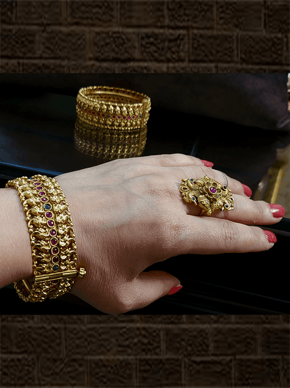 Small elephant faces connecting design openable kada's on both sides of ruby and stone line in the middle - Odara Jewellery