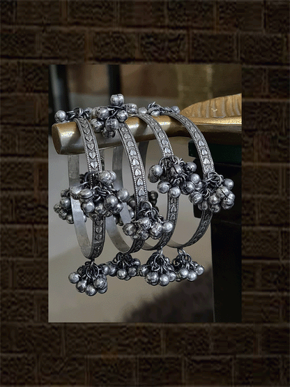 Set of four oxidised self heart design hanging ghunghru bangles - Odara Jewellery