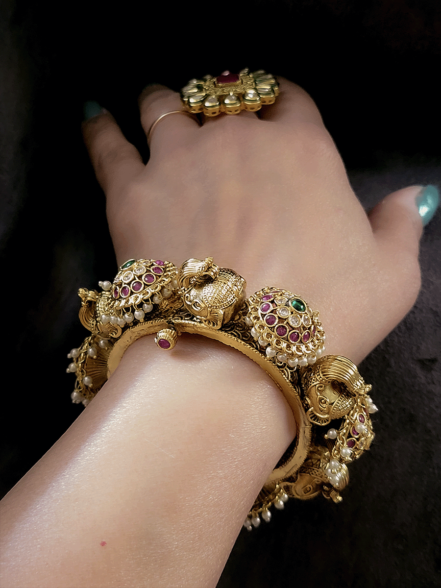 Ruby,polki and green stones pacheli style kadas with elephant design