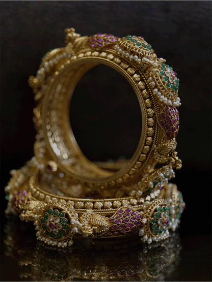 Set of two openable kadas with peacocks and also kundan with green stone flower tukdies with pearly hangings - Odara Jewellery
