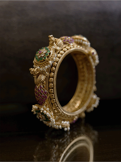Set of two openable kadas with peacocks and also kundan with green stone flower tukdies with pearly hangings - Odara Jewellery