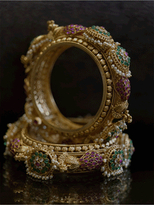 Set of two openable kadas with peacocks and also kundan with green stone flower tukdies with pearly hangings - Odara Jewellery