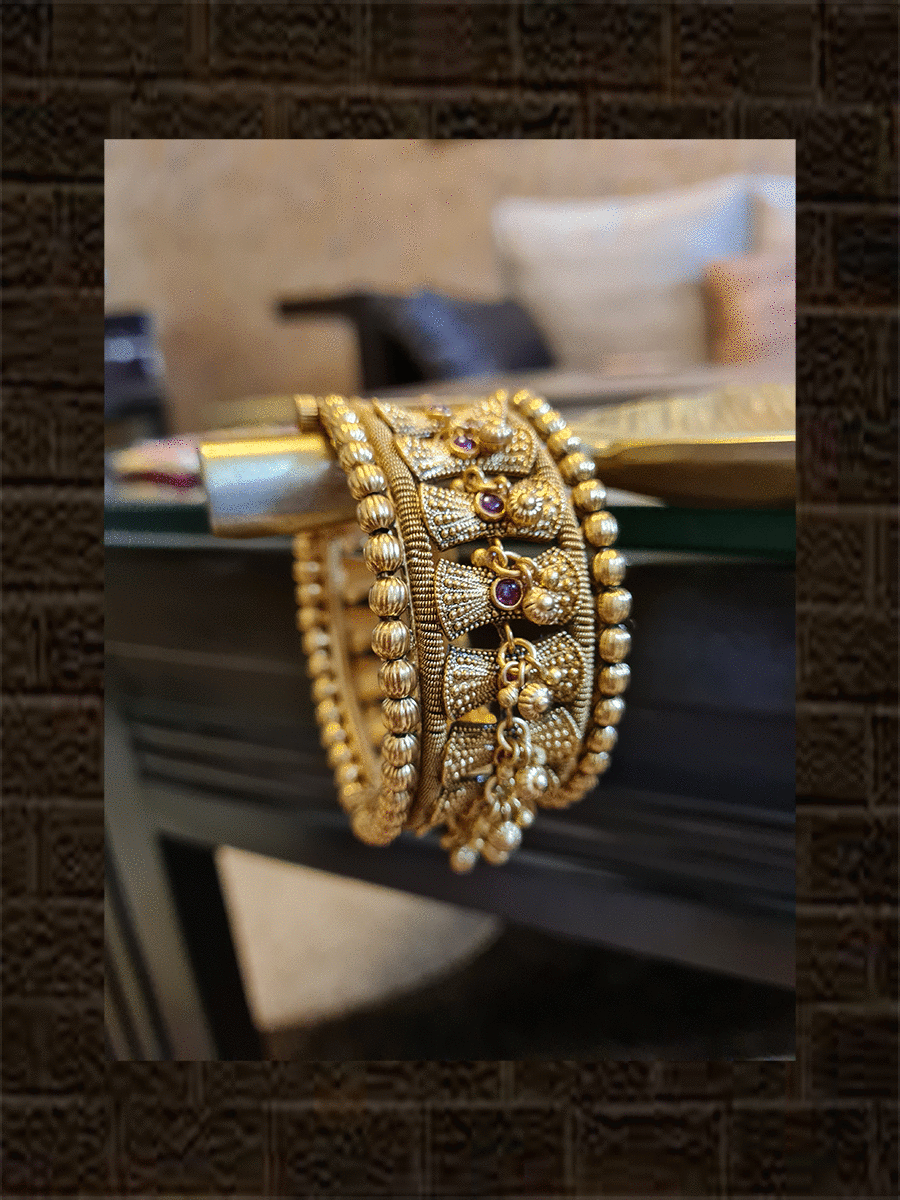 Broad antique gold finish damru design ruby stone openable kada's with hanging ghunghru's - Odara Jewellery