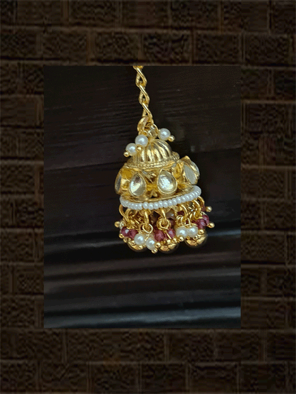 Rectangular kundan tukdi with multiple cheed strings bracelet rakhi with ruby and green bead detailing and hanging kundan jhoomki - Odara Jewellery