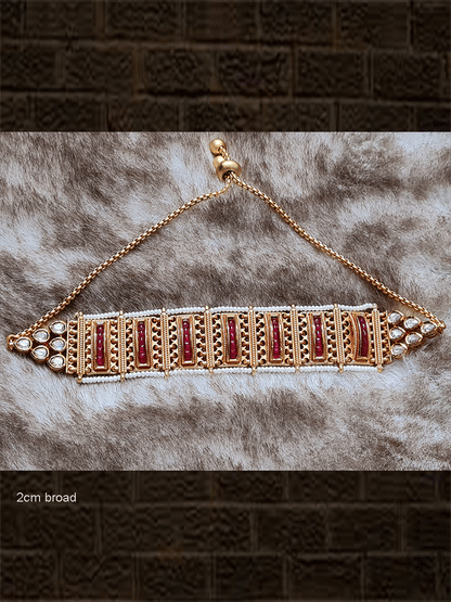 Broad gold chain with side pirohi work and kundan bracelet with ruby stone lines in between - Odara Jewellery