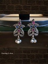 Load image into Gallery viewer, Stone studded inverted peacock design german silver earrings with hanging ghunghru&#39;s - Odara Jewellery