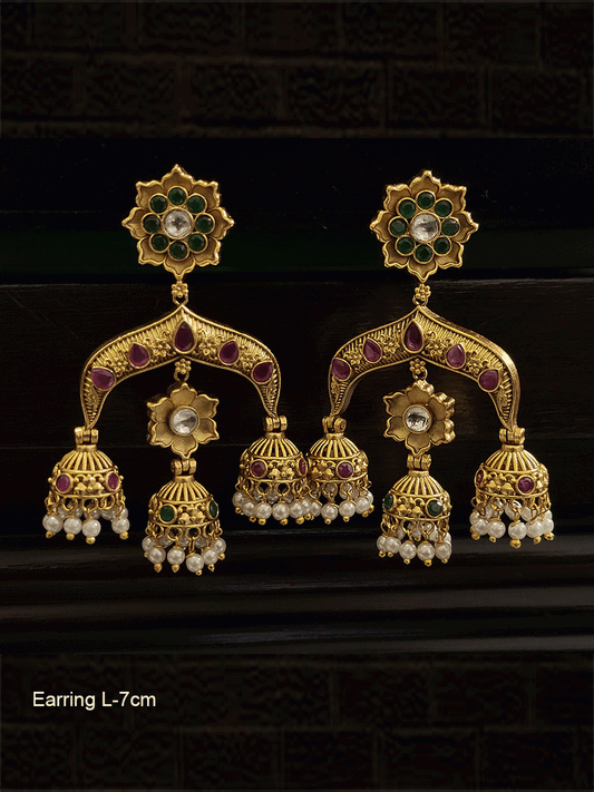 Kundan and green flower top ruby stones studded three jhoomki earrings