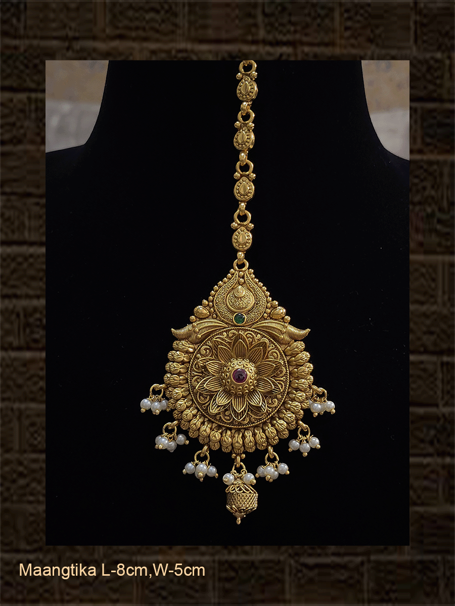 Circular maangtika with center ruby stone bold flower design and leaf design chain - Odara Jewellery