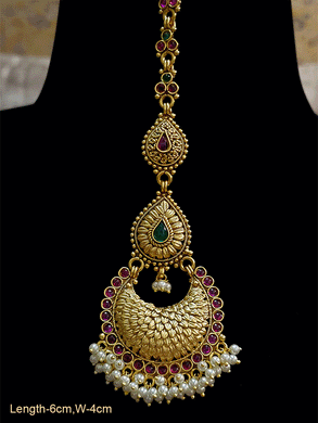 Tear drop shaped ruby and green stones in leaf design tukdies maangtika with pearly hangings - Odara Jewellery