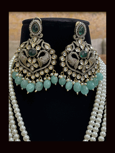 Eight inch long three pearl strings AD,kundan set with elephant motifs in antique finish