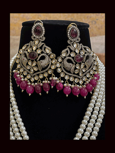 Eight inch long three pearl strings AD,kundan set with elephant motifs in antique finish
