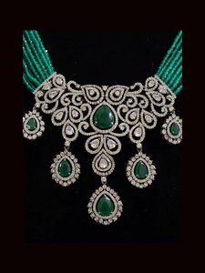 Black finish AD and stone studded multi string neckpiece